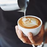 Person Performing Coffee Art