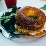 Sandwich With Vegetables on White Ceramic Plate